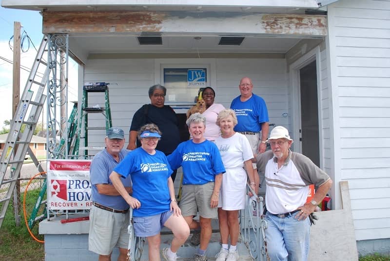 Kim, Mark, and the volunteers who rebuilt their home.